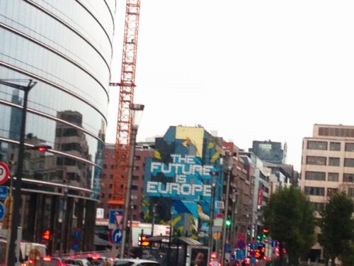 Brussels street mural reading 'The Future Is Europe' seen from the city journey